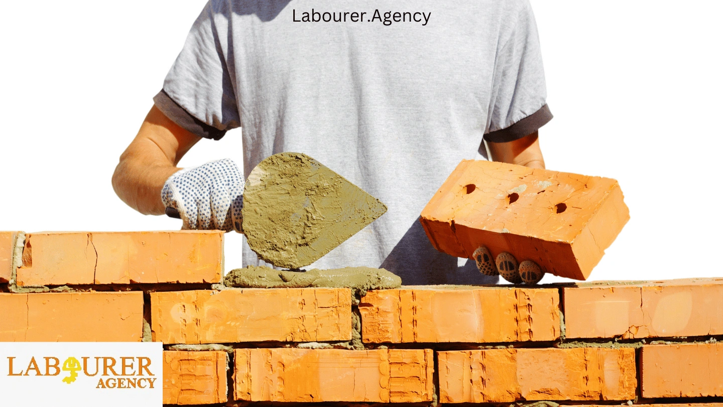 Bricklayer wearing proper safety equipment on a construction site